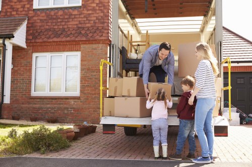 Careful handling of household items during a Merton flat removal