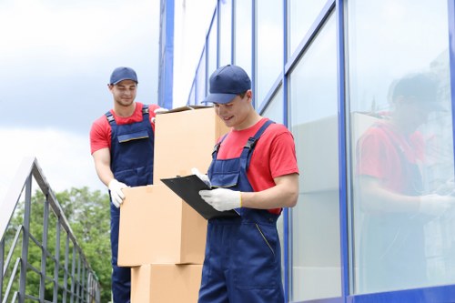 People moving storage items safely in a clean facility