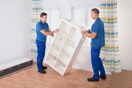 Careful flat removal service in Merton with stairs and access planning